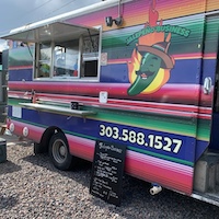 Brightly colored food truck with jalapeno illustration