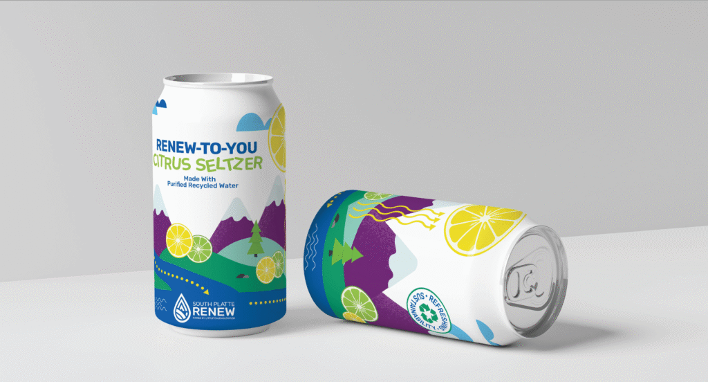 Seltzer cans designed by YellowDog--two cans are depicted against a white background. Label design includes the words "Renew-to-you Citrus Seltzer" and depicts a blue river snaking between green banks with illustrated lemons and limes and purple mountains in the background.