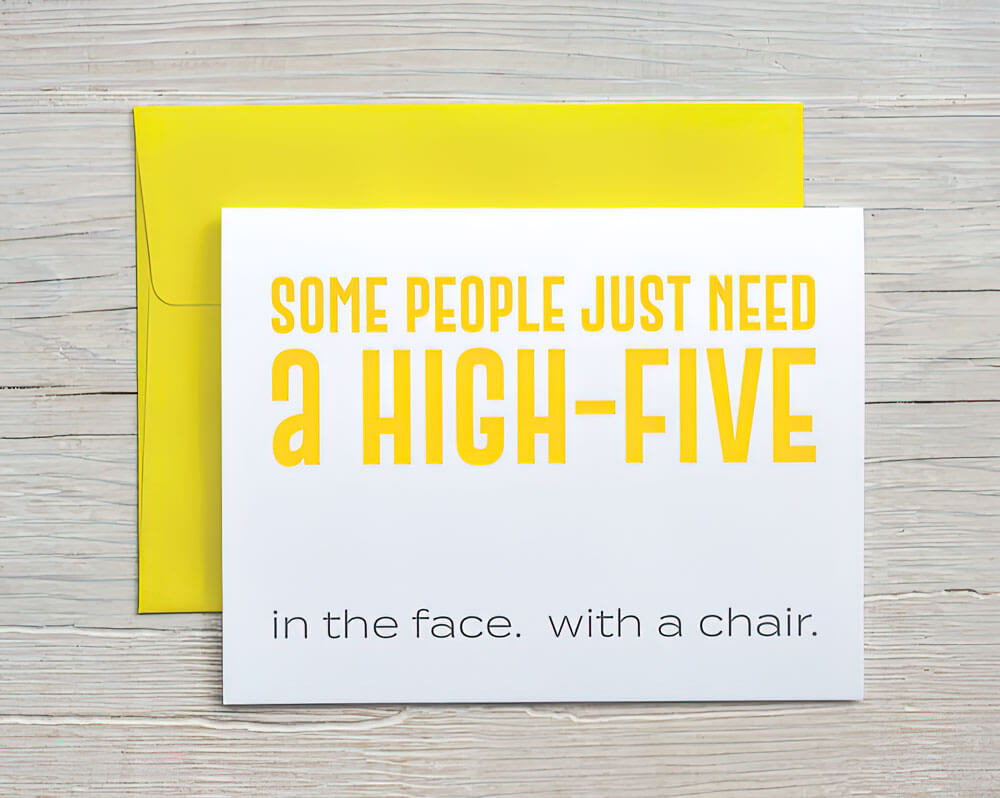greeting card that says "some people just need a high-five. in the face. with a chair" with a yellow envelope