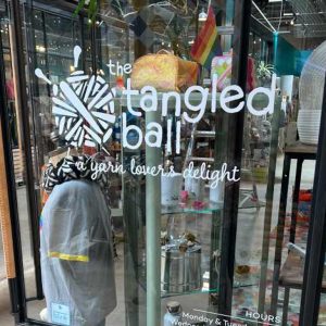 The Tangled Ball window signage